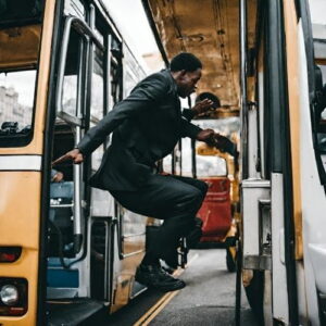 A Man Getting Down from a Moving Bus: